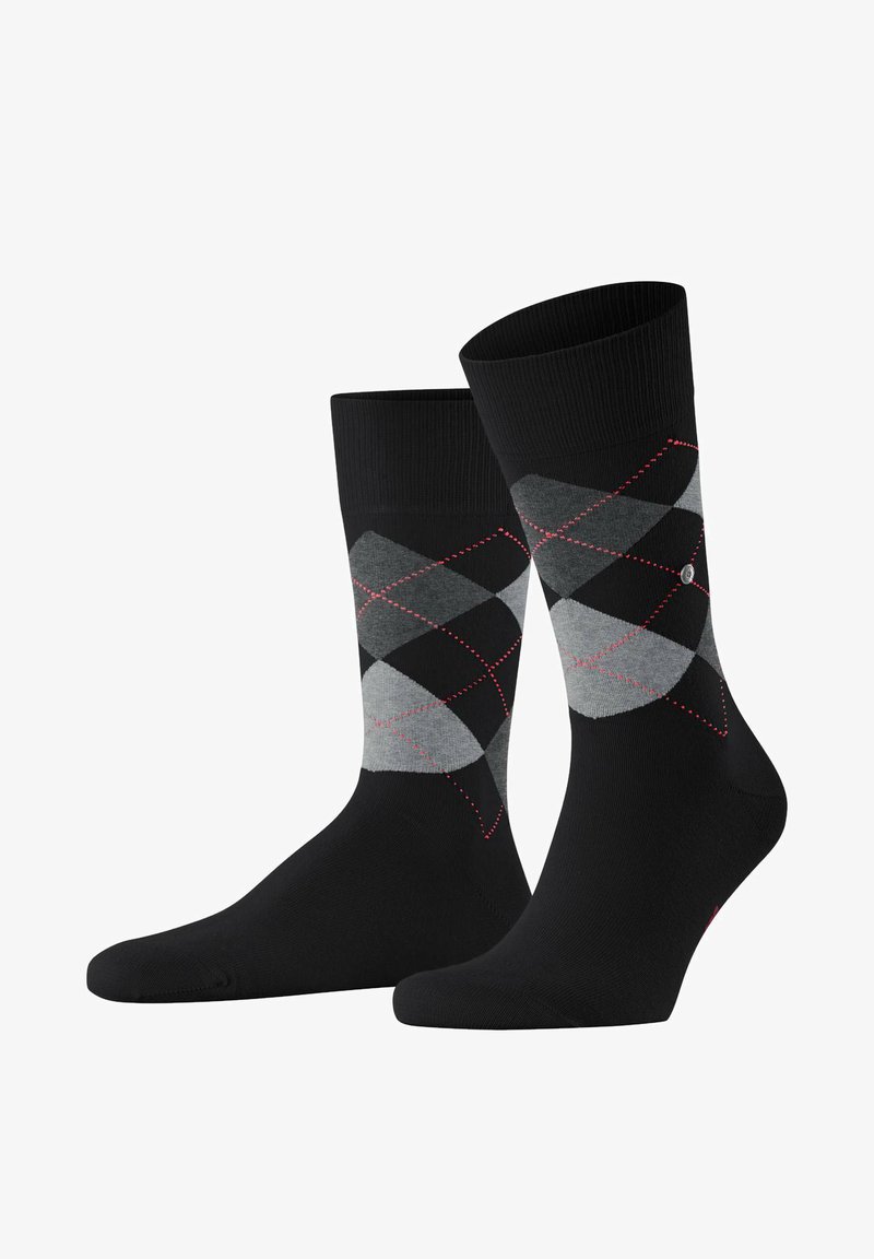 Calze nere con un motivo argyle grigio, dettagli rossi e cuciture diagonali. Realizzate in un tessuto liscio, hanno una lunghezza classica alla caviglia.