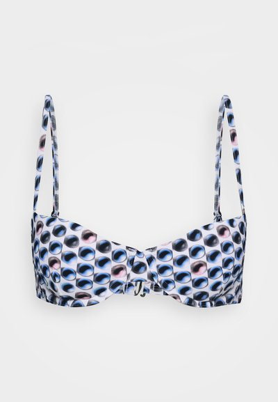 Bikini topp med justerbare stropper, med en hvit bunn dekorert med runde fargerike prikker i nyanser av blått, svart og rosa.