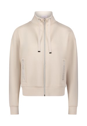 Sweat-shirt beige clair zippé avec un col montant, des cordons ton sur ton, des poches latérales ornées de strass, et une coupe décontractée.