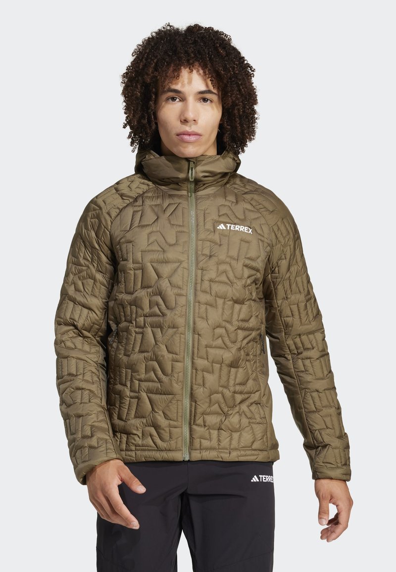 Olive green insulated jacket with a textured, geometric pattern. Features a full zipper, high collar, and branding on the chest.
