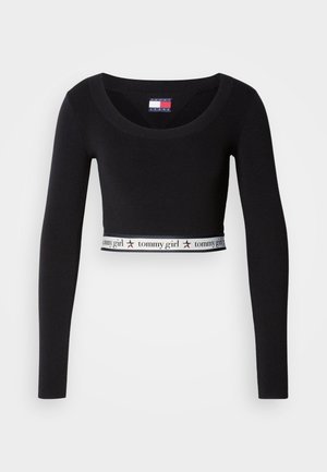 Top corto negro de manga larga con escote amplio y una banda elástica en el dobladillo con el logo que lleva el texto "tommy girl".