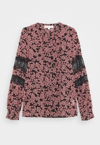 Blouse noire avec un petit motif floral rose, manches longues ornées de détails en dentelle noire, et un col rond avec un détail de bouton à l'avant.