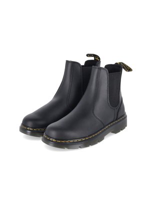 Paar schwarze Leder-Chelsea-Stiefel mit elastischen Seitenteilen, gelber Naht an den Sohlen und gebrandeten Zuglaschen hinten.
