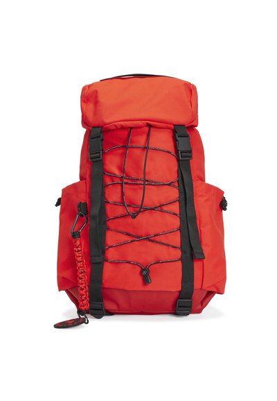 Bright red backpack with black straps, bungee cords on front, side pockets, and a red paracord keychain attached to left side.
