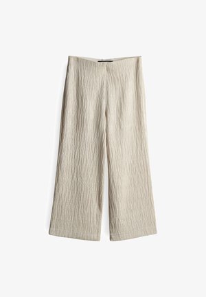 Beige wijde broek van textuurstof met verticale plooien, een rechte zoom en zonder zichtbare sluitingen of zakken.