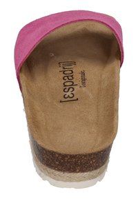 Pink suede slip-on shoe with a cork and jute sole, featuring a smooth, textured footbed and a rounded toe design.