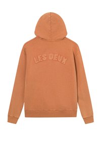 Kapuljača u boji izgorene naranče. Ima prednji logo "LES DEUX" u tonu vezenja. Napravljena od mekog materijala s rebrastim manžetama.