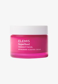 Rosa glasskrukke med hvit lokk, merket "ELEMIS Superfood Midnight Facial Nourishing Sleeping Cream." Glatt tekstur, rund form.