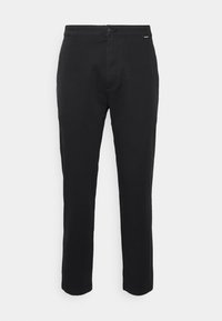 Black trousers made of smooth fabric, featuring a straight cut, button closure, and subtle logo detail near the waistband.