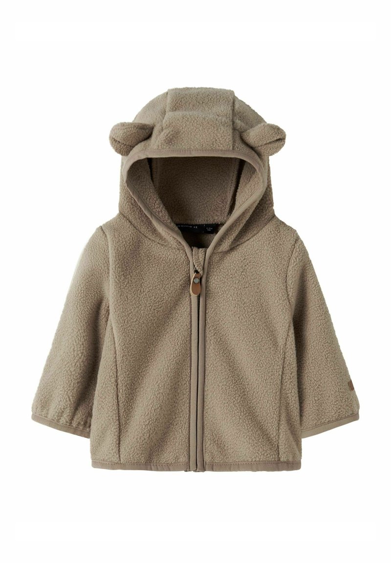 Giacca in pile per toddler di un morbido beige con zip frontale e cappuccio, dotata di piccole orecchie in tessuto per un tocco giocoso.