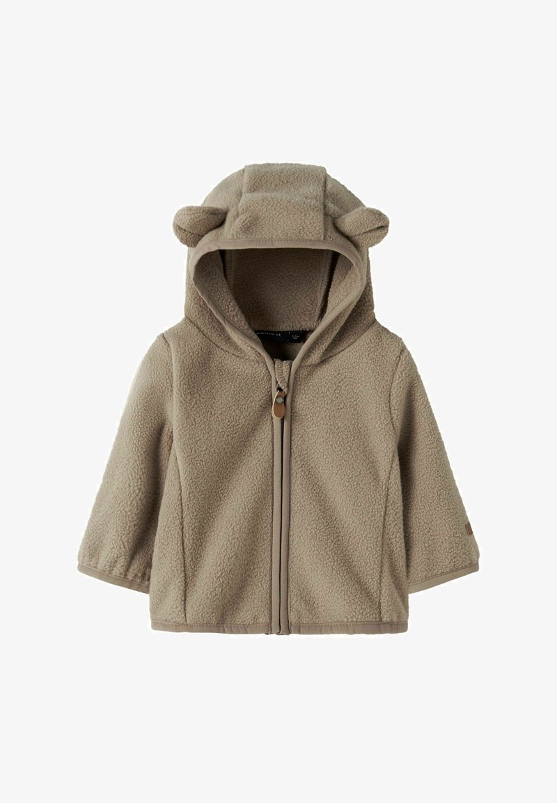 Giacca in pile per toddler di un morbido beige con zip frontale e cappuccio, dotata di piccole orecchie in tessuto per un tocco giocoso.