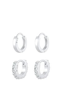 Boucles d'oreilles en argent sterling, présentant une finition lisse et ornées de cristaux transparents, mettant en valeur un design poli et une forme circulaire.