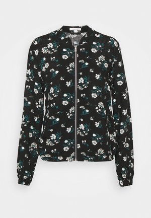 Czarna kurtka na suwak z długim rękawem, białym i zielonym kwiatowym wzorem, elastycznymi mankietami i okrągłym kołnierzem.