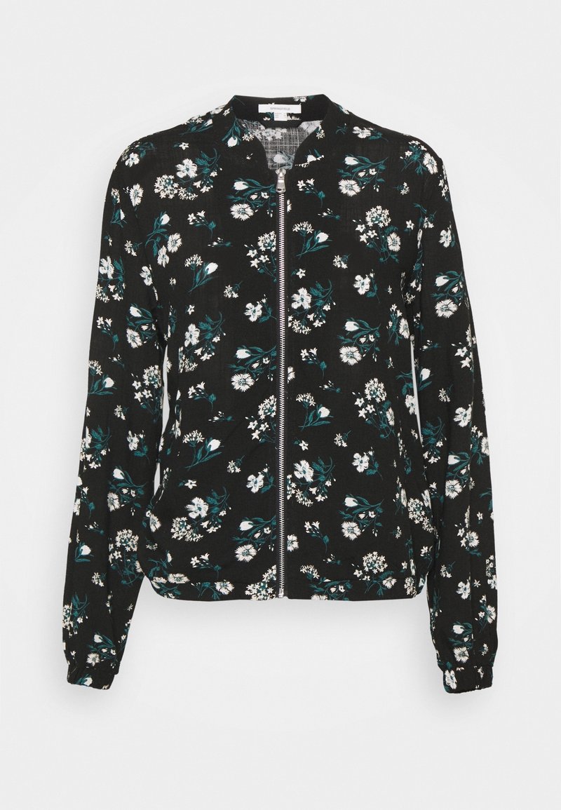 Veste noire à manches longues avec fermeture éclair, motif floral blanc et vert, poignets élastiques et col rond.