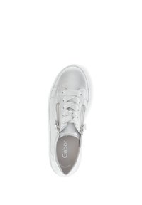 White sneakers with a metallic finish, featuring lace-up front, dual side zippers, rounded toe, and a textured rubber sole.
