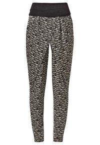 Neruudud musta ja valge mustriga jope, millel on lai, elastne vöökoht. Omab lõdva istuvust ja kitsenevat jala disaini. Tekstuuriga kangas koos kirjutistega.