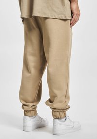 DOGHAMMER Jogginghose - taupe - Zalando.ch