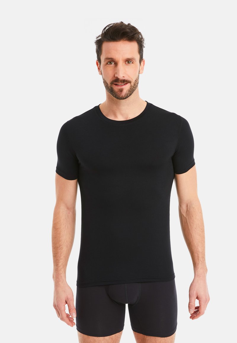 Black short-sleeve t-shirt with a round neckline, fitted design, smooth texture, and minimal stitching detail, worn over black underwear.