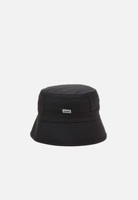 Black bucket hat made of waterproof material, featuring a rounded crown, wide floppy brim, and a stitched texture with a small logo tag.