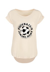 Cream-colored T-shirt with short sleeves featuring a black graphic of a soccer ball and text reading "FOOTBALL'S COMING HOME."