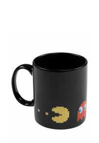Tazza in ceramica nera con personaggi pixelati retro di Pac-Man giallo e fantasma rosso stampati vicino alla base.