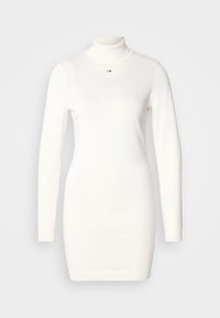 Rochie albă cu manșon lung și guler înalt, confecționată dintr-un material tricotat fin. Prezintă o croială ajustată și un mic logo pe piept.