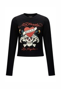 Black long-sleeve cropped shirt featuring a graphic design with a skull, heart, and decorative elements. Text reads "Ed Hardy," "Kills," and "Love Slowly."