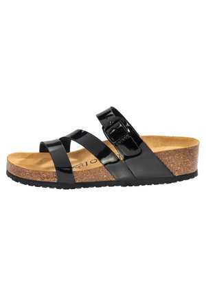 Sandale en cuir verni noir avec semelle en liège, bride ajustable et semelle texturée. Dispose de trois brides croisées et d'une boucle latérale.