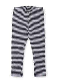 Leggings a righe bianche e nere, realizzati in un morbido tessuto e con un elastico in vita. Progettati per una vestibilità aderente con una gamba dritta.