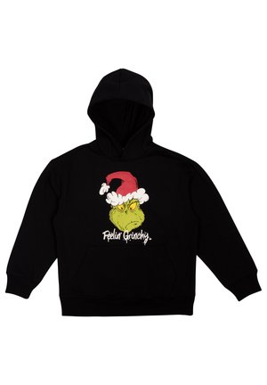Due adolescenti sorridenti che indossano felpe nere con cappuccio con una faccia verde del Grinch e un cappello rosso da Babbo Natale, testo "Feelin Grinchy,", entrambi con le mani nelle tasche.