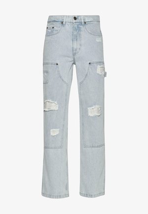 Light blue denim cargo pants with distressed patches, wide-leg design, two side pockets, and rivet accents.