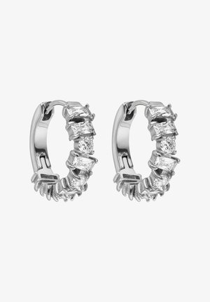 Silver hoop earrings featuring oval and round clear gemstones, with a textured band design and a secure hinge closure.