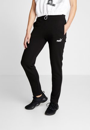 Schwarze Jogginghosen aus weichem Stoff mit elastischem Bund, ausgestattet mit seitlichen Taschen und einem weißen Puma-Logo auf dem linken Oberschenkel.