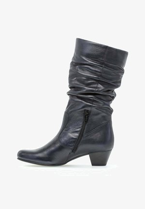 Botte noire en cuir mi-mollet avec tige décontractée, fermeture éclair latérale, bout arrondi et petit talon empilé.