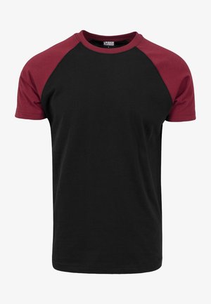 Black t-shirt with maroon raglan sleeves. Made of cotton, featuring a crew neck and a smooth texture. No visible patterns or hardware.