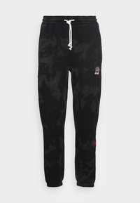 Black tie-dye sweatpants made of soft fabric, featuring a drawstring waistband and embroidered accents in pink on the sides.