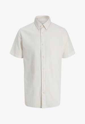 Kortærmet hvid skjorte med knapper, spids krave og syv synlige knapper foran.