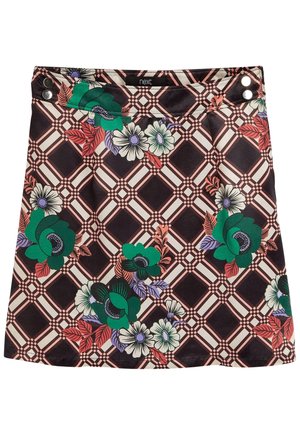 Jupe avec motif à carreaux noir et beige présentant de grands motifs floraux verts, blancs, rouges et violets ainsi que des boutons-pression argentés à la taille.