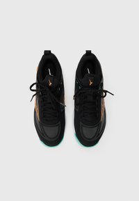 Pair of black and gray athletic shoes with orange accents and black laces, viewed from above on a white background.