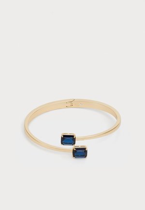 Gold-tone bracelet with two rectangular blue stones, featuring a minimalist design and a smooth, polished finish.