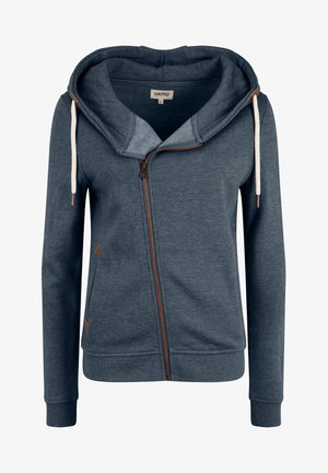 Kapućasta dukserica na zatvaranje u tamnoplavoj tkanini. Ima kremaste vezice, smeđi patentni zatvarač i smeđe akcentne detalje na džepovima. Mekana tekstura.