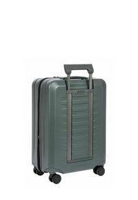 Valise à coque rigide de couleur vert foncé, équipée d'une poignée rétractable, d'une surface texturée et de quatre roues pivotantes pour une meilleure mobilité.