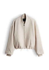 Beige bomber jacket with a zip front, ribbed collar, and drawstring hem. Features side pockets and a smooth texture.