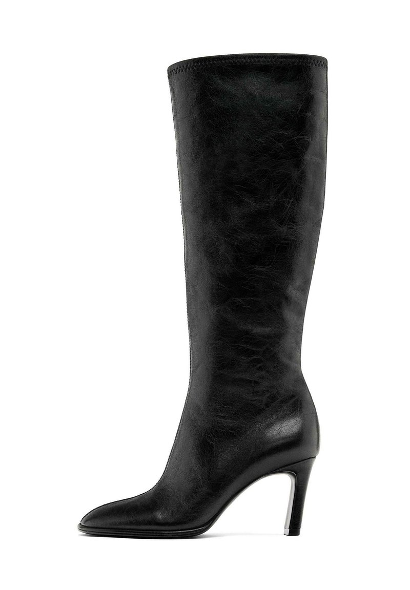 Knee-high black leather boot with a pointed toe and a slim high heel. Smooth texture with a seamless design and no visible hardware.