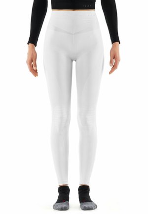 Weiße hochtaillierte Leggings mit geripptem Muster, figurbetontem Design und Kniepaneelen. Glatter Stoff mit dezentem Branding an der Taille.