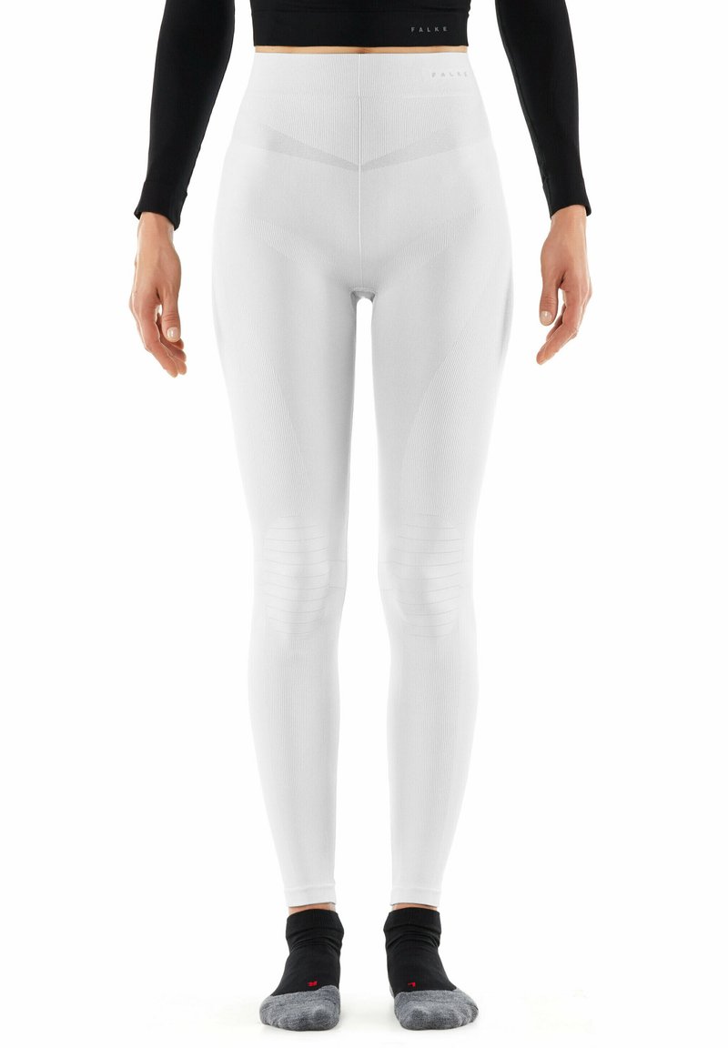 Witte hoge taille legging met ribbelstructuur, aansluitend ontwerp en kniestukaccenten. Glad materiaal met subtiele merkvermelding bij de taille.