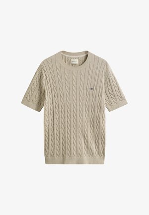 Maglione beige a maniche corte con lavorazione a trecce, collo girocollo, polsini e orlo a costine, con piccolo logo ricamato sul petto.