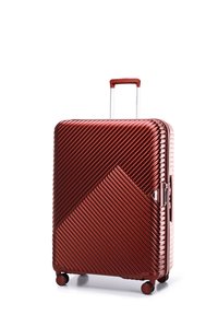 Harde koffer in metallic koper, met diagonale ribbelstructuur, een uitschuifbare handgreep en vier zwarte wielen voor mobiliteit.