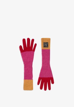 Long knitted gloves with red fingers, pink middle section, and orange cuffs, one glove showing black label with "Thinking Me" text.