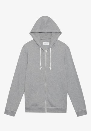 Šviesiai pilkas zip-up džemperis su baltais raišteliais, priekinėmis kišenėmis ir kapisonu, padėtas plokščiai prieš baltą foną.